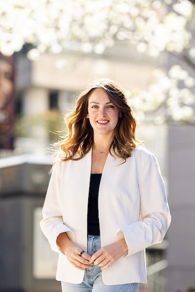A portrait of Irina Voloshina smiling outdoors on Loyola University Chicago's campus