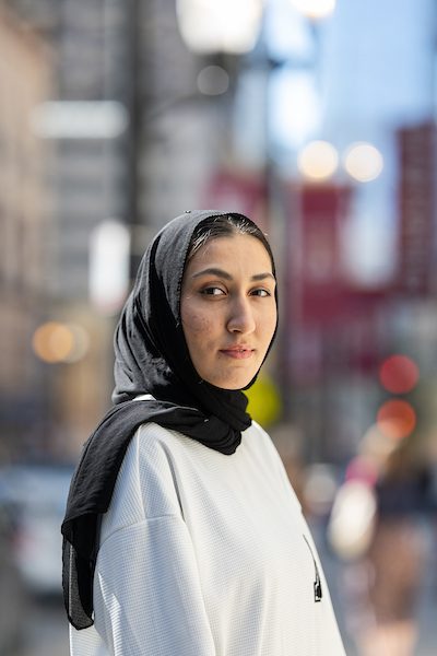 A portrait of Nazia Azizi smiling outdoors on Loyola University Chicago's campus