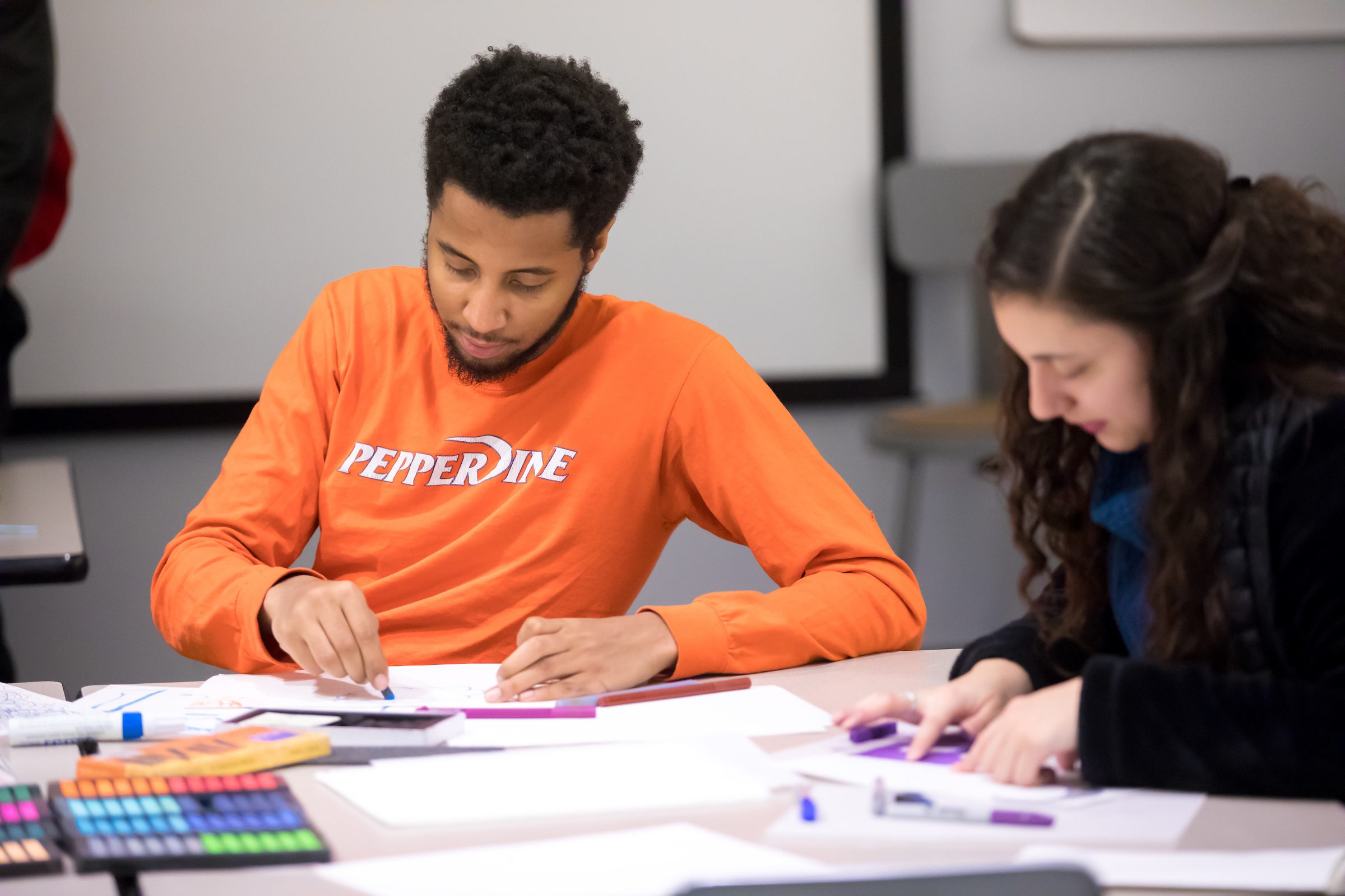 Arrupe College student Ilyas Ahmed works on an art project in the art studio in Maguire Hall on February 28, 2019. This year Arrupe College celebrates their second collaboration with the Loyola University Museum of Art. Student projects individually developed out of class will be featured, alongside photographs and 2-dimensional work from Arrupe’s inaugural Foundation Studio/2D-Design class. This exhibition will be curated by Susannah Kite Strang, professor at Arrupe College.(Photo: Lukas Keapproth)