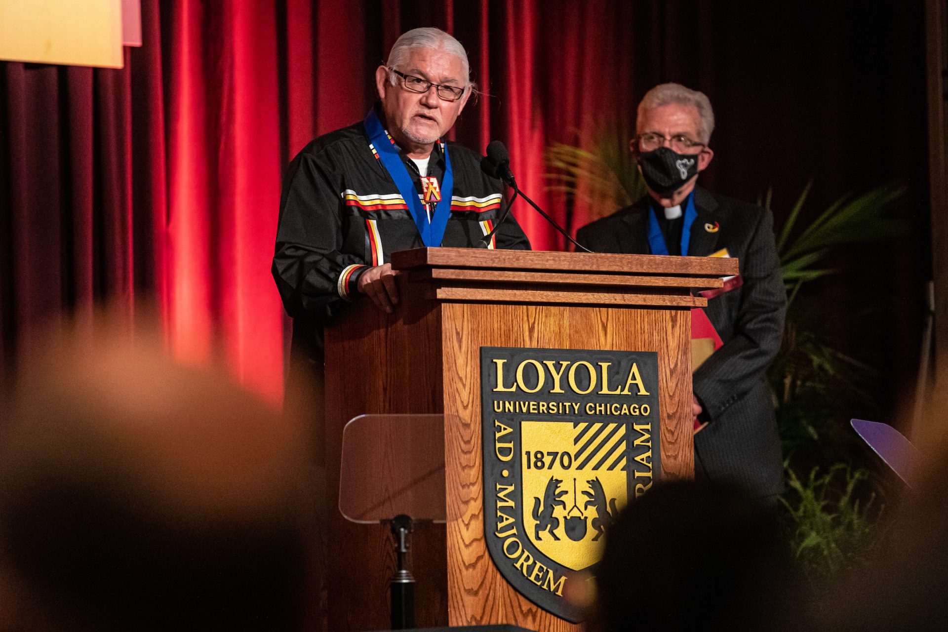 A finalist speaking at the podium.