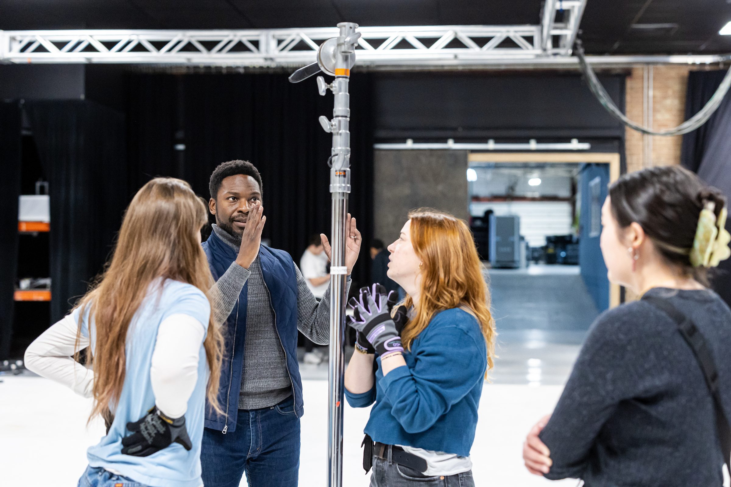 Professor Vincent Singleton teaches School of Communications students in his cinematography class held at Resolution Studios on the near west side of Chicago. As part of the assignment, Singleton's students work to recreate a scene from a chosen film to learn more about lighting and camera work. (Photo: Lukas Keapproth)